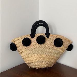 Straw mini handbag with black pom pom
